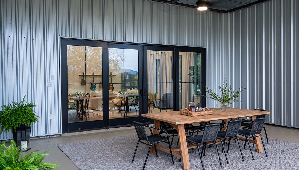 Exterior Black Four-Panel MIRA Bi-Parting Sliding Patio Doors